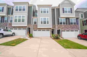 Tega Cay house for rent - a digital painting of an apartment building with cars parked in the driveway