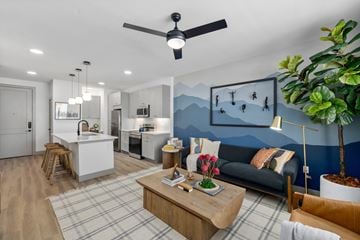 Denver apartment for rent - a living room with a couch and a table