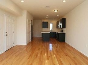 Philadelphia apartment for rent - an empty living room and kitchen with wood floors