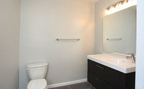 Philadelphia apartment for rent - a bathroom with a toilet and a sink and a mirror