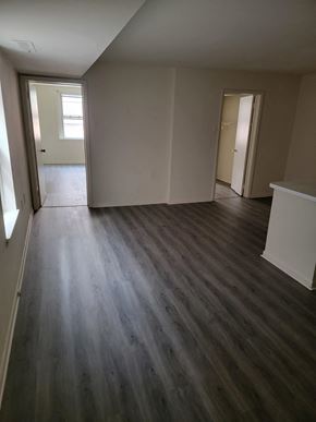 Philadelphia apartment for rent - an empty living room with wooden floors and white walls