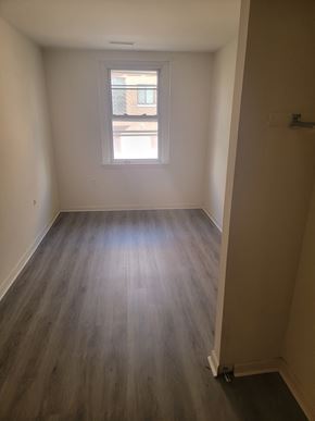 Philadelphia apartment for rent - an empty room with wooden floors and a window