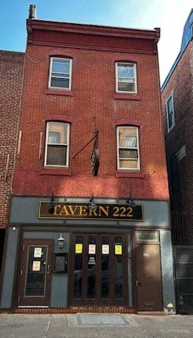 Philadelphia apartment for rent - a brick building with a sign on the front of it