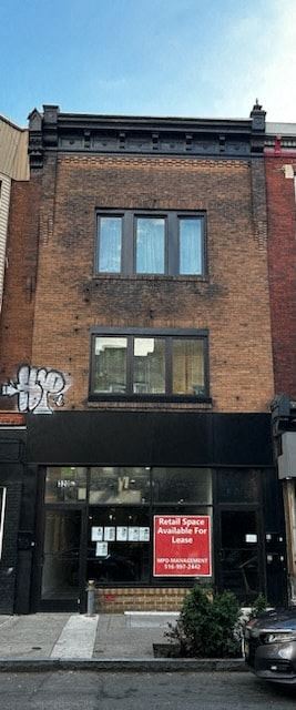 Philadelphia apartment for rent - a brick building with a red sign in front of it