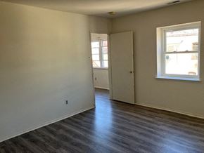 Philadelphia apartment for rent - a living room with white walls and a wood floor