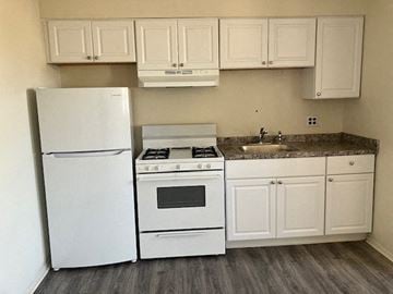 Philadelphia apartment for rent - a kitchen with a stove refrigerator and a sink