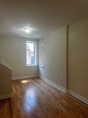Philadelphia apartment for rent - a living room with wood floors and a window