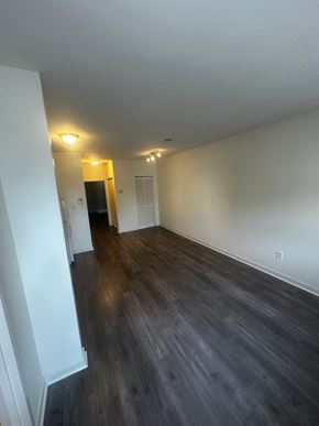 Philadelphia apartment for rent - an empty living room with wooden floors and white walls