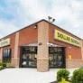 Bridgeton apartment for rent - a building with a doughnut shop on the side of it