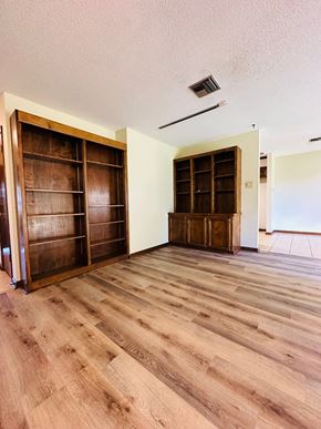 Lafeyette house for rent - a living room with wooden floors and a closet with wooden doors