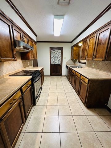 Lafeyette house for rent - a kitchen with wooden cabinets and tiled floors