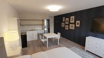 Kalispell apartment for rent - a living room and dining room with a table and a tv