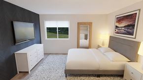 Kalispell apartment for rent - a bedroom with a bed and a television