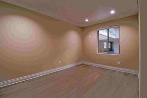 Inglewood apartment for rent - a bedroom with a hardwood floor and a window