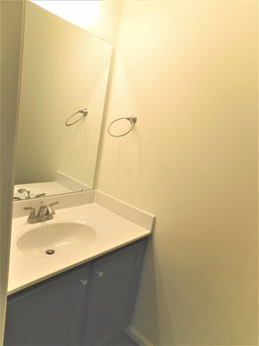 Midway Park house for rent - A bathroom sink with a mirror above it.
