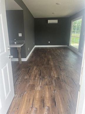 Chadbourn house for rent - an empty room with wooden floors and a sink