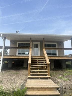 Chadbourn house for rent - a house with a porch and stairs in front of it