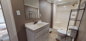 Whiteville house for rent - a bathroom with a sink and a shower and a toilet