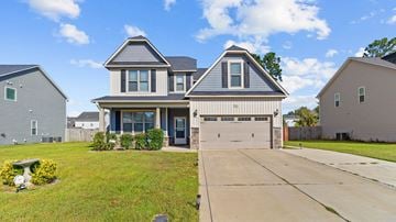 Parkton house for rent - a house with a garage and a driveway