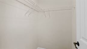 Parkton house for rent - a walk in closet with white walls and a wire rack on the ceiling