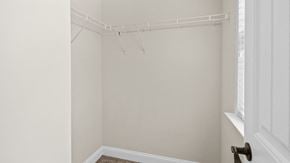 Parkton house for rent - an empty closet in a bedroom with white walls and a window