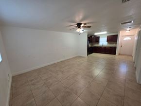 Fort Myers apartment for rent - A room with a ceiling fan and tiled flooring.