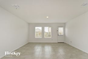 Princeton house for rent - a spacious living room with white walls and tile floors