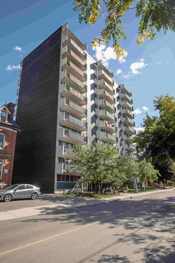 Ottawa apartment for rent - an apartment building on a street with a car