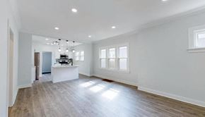 Hammond house for rent - an empty kitchen and living room with white walls and wood floors