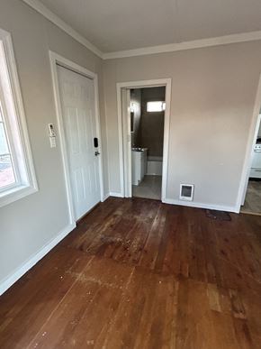 Soap Lake house for rent - a living room with wooden floors and a door to a bathroom