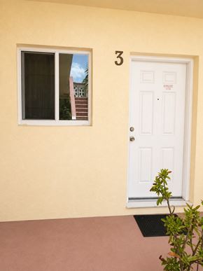 Hallandale Beach apartment for rent - A white door with a number 3 above it.