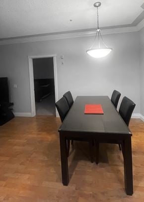Edmonton apartment for rent - a dining room with a table and chairs
