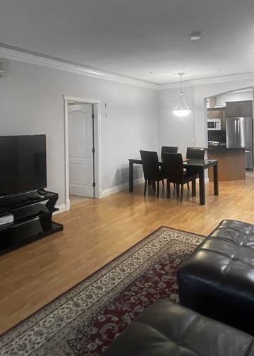 Edmonton apartment for rent - a living room with a couch and a table and a tv