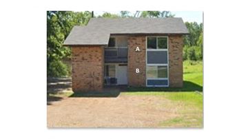 Hughes Springs house for rent - this is a picture of a brick house with the letter b on it