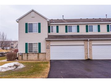 Rochester house for rent - a white house with green shutters and a white garage door