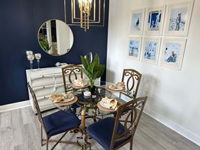 Bradenton house for rent - a dining room with a table and chairs and a mirror