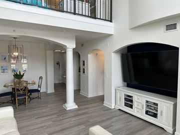 Bradenton house for rent - a living room with a tv and a dining room