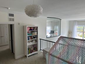 Bradenton house for rent - a bedroom with a bed and a dresser and a mirror