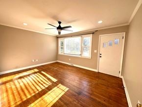 Mauldin house for rent - an empty living room with wooden floors and a ceiling fan
