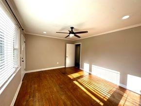 Mauldin house for rent - a living room with wood floors and a ceiling fan