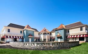 Waretown apartment for rent - Ocean Pointe Plaza is a large building complex with multiple storefronts.