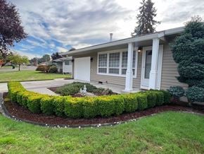 Longview house for rent - A house with a well-maintained front yard and landscaping.