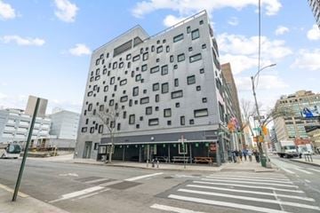 New York apartment for rent - a building on the corner of a street in a city