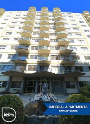 New Westminster apartment for rent - A tall building with balconies and a sign that says "Imperial Apartments".