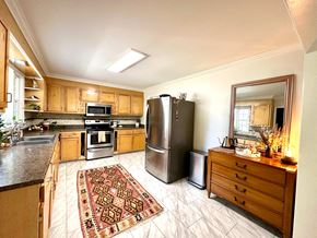 Greenville house for rent - a kitchen with stainless steel appliances and wooden cabinets