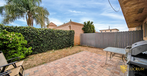 San Fernando apartment for rent - a backyard with a fence and a table and a grill