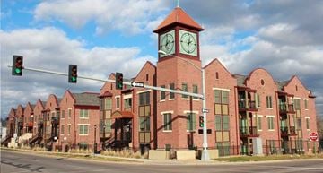 Des Moines townhouse for rent - a large brick building with a clock tower on top of it