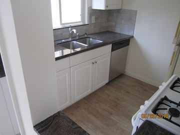 Long Beach apartment for rent - A kitchen with a sink and a window.