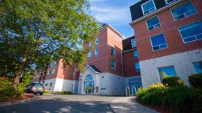 Peterborough apartment for rent - a building with a car parked outside of it
