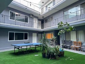 Los Angeles apartment for rent - a room with a ping pong table and plants